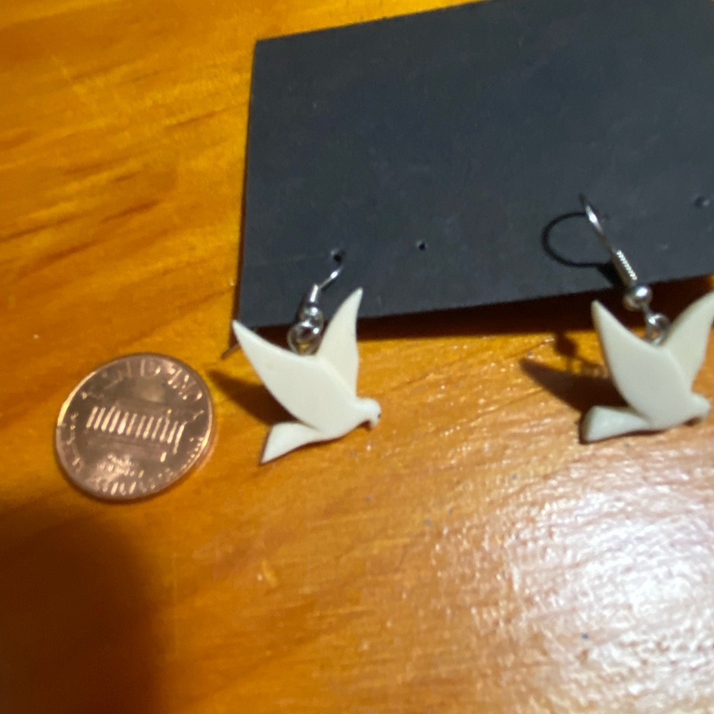 Hand-carved delicate dove earrings. NWT Never been worn